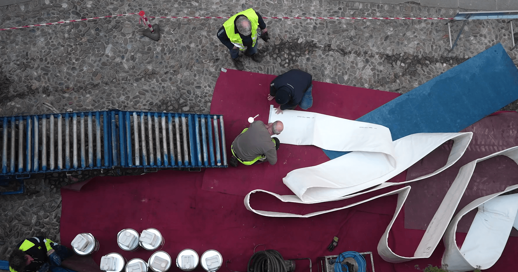 Technician performing trenchless pipe rehabilitation inside pipeline