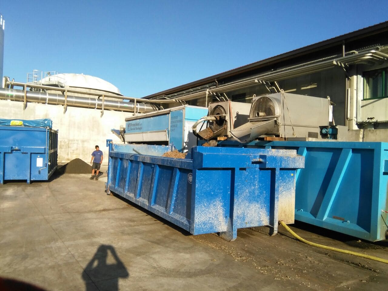 Industrial sludge dewatering with specialized machinery for volume reduction and safe handling