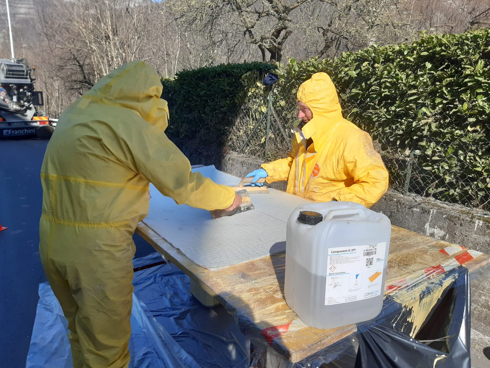 Technician repairing sewer pipes using relining or packer trenchless methods for damaged underground pipelines